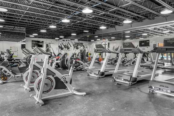 A gym with treadmills and elliptical machines. at Riverchase Landing, Hoover