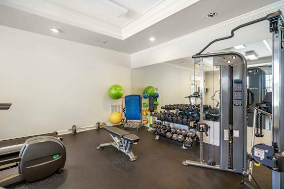 A well-equipped gym with various exercise machines and equipment.