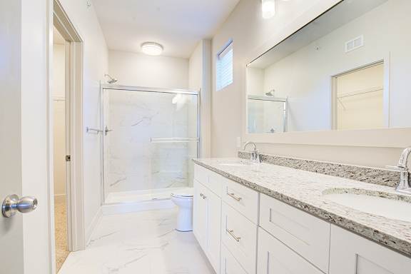 Bathroom with Large Mirror at Midtown Row Apartments, Montgomery, AL, 36106