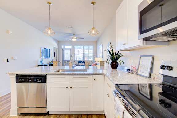 Kitchen with Black Appliances at Midtown Row Apartments, Montgomery