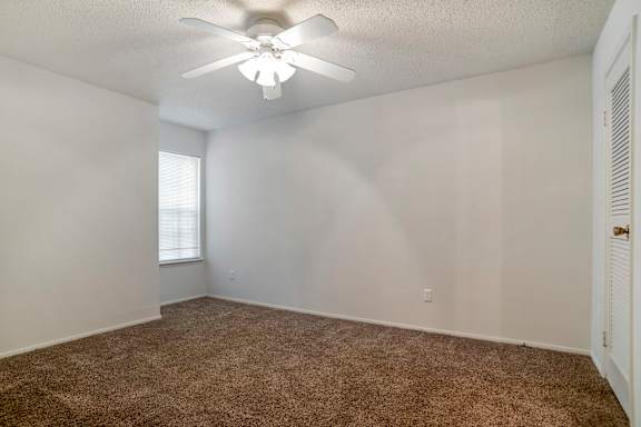 A room with a ceiling fan and carpeted floor at Pear Orchard, Ridgeland, MS, 39157