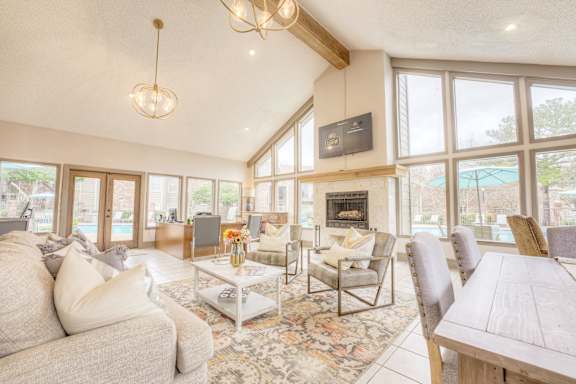A living room with a fireplace and a television at Pear Orchard, Ridgeland, MS, 39157