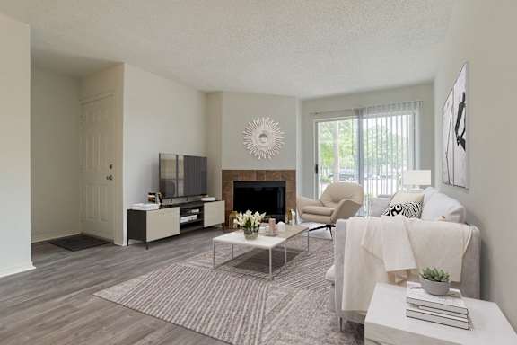 Living Room with Fire Place at Reflection Pointe Apartments in Flowood, MS