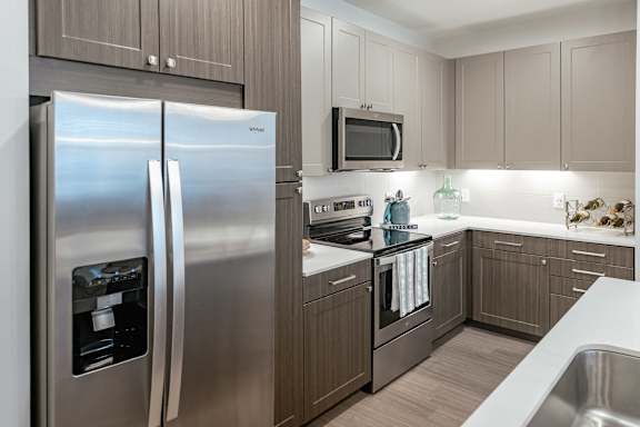Kitchen with Refrigerator at Stone Loch Apartments, Texas