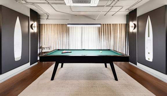 Billiards room with green felt pool table at The Hamilton Apartments, Miami, FL