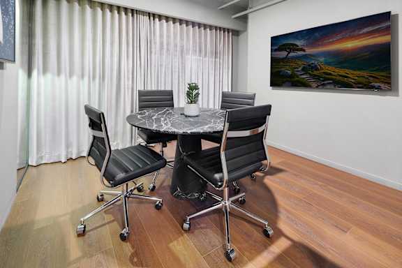 Conference room with marble table and leather chairs at The Hamilton Apartments, Miami, Florida
