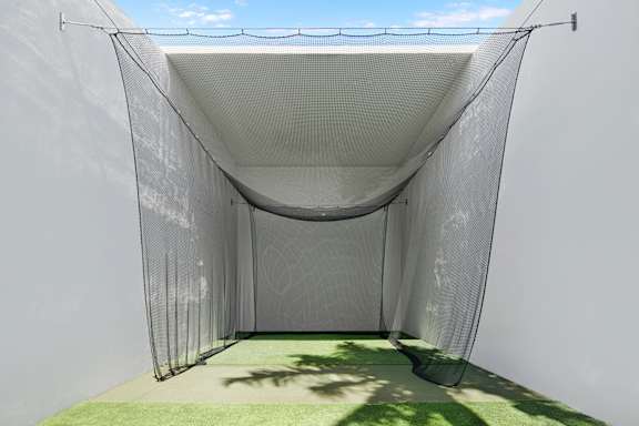 Outdoor golf practice net and turf area at The Hamilton Apartments, Florida, 33137