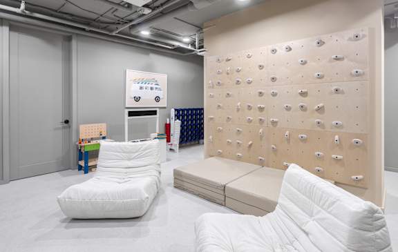 Kids play area with climbing wall and foam mats at The Hamilton Apartments, Miami, 33137