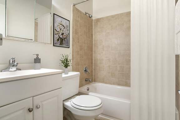 A Bathroom with White Toilet at The Manor/The Manor East Apartments, Leesburg, Virginia