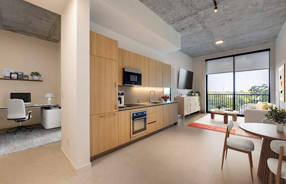 a kitchen and living room in a 555 waverly unit