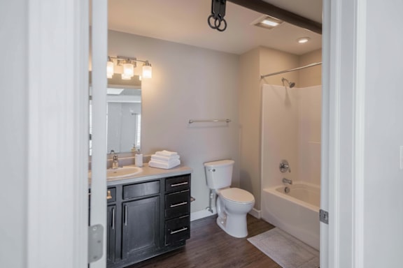 A bathroom with a white toilet and a white sink.