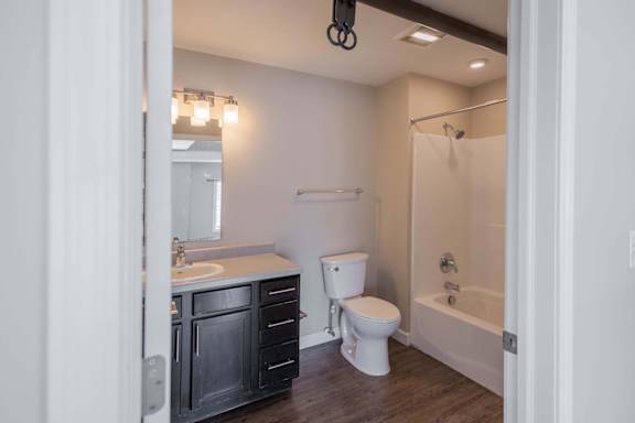 A bathroom with a white toilet and a white sink.