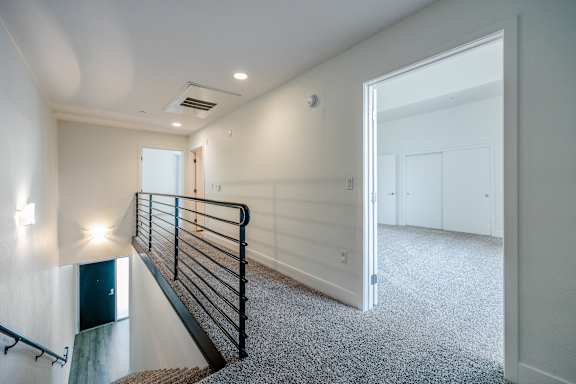 a view of the top of a staircase in a new home