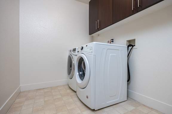 a washer and dryer in the laundry room of an apartment