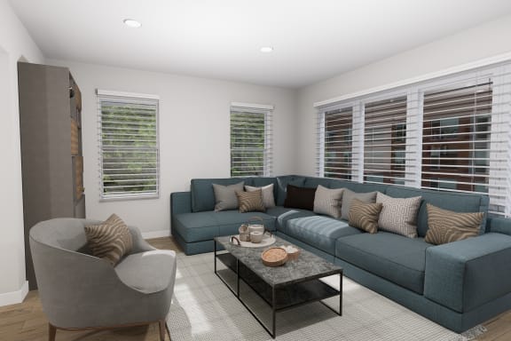 a living room with a blue couch and a coffee table