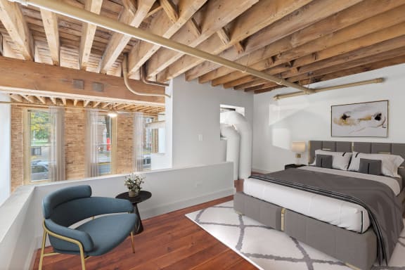 a bedroom with a bed and a ceiling with wooden beams