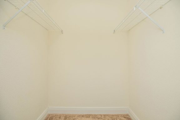 A room with white walls and a carpeted floor. at The Cove at State Street Apartments, Louisiana