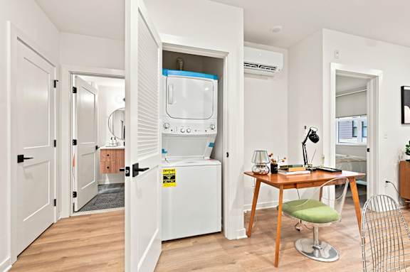 A small kitchen with a table and a chair.