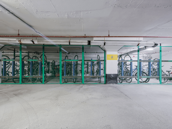 the inside of a parking garage with bikes in it