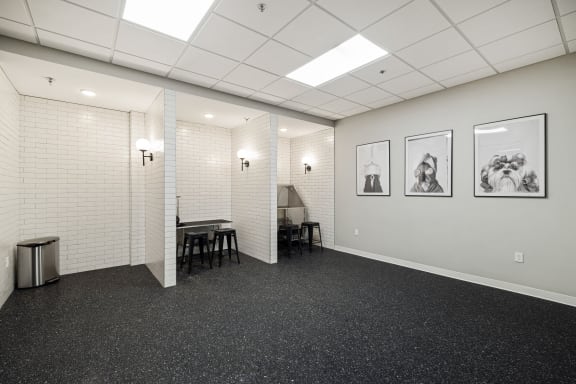 an empty room with white walls and a table and chairs at EagleRidge Plaza Residences, North Dakota