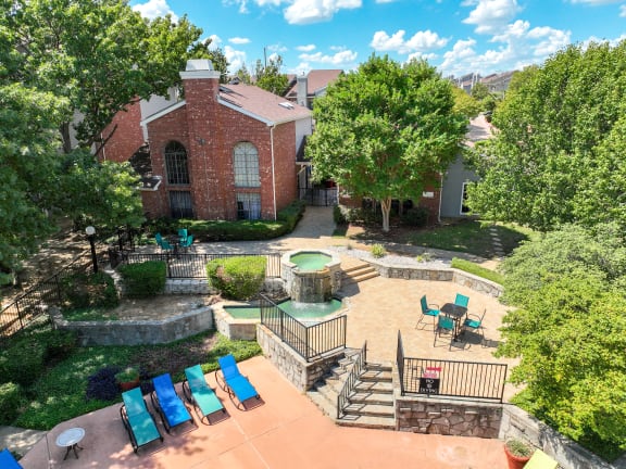 an aerial view of a backyard with a patio and a pool