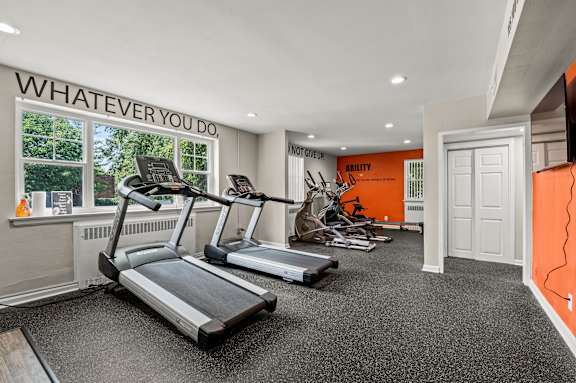 the gym at the enclave at woodbridge apartments in sugar land, tx