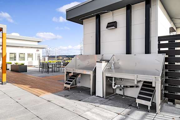 A machine is on a patio outside a building.