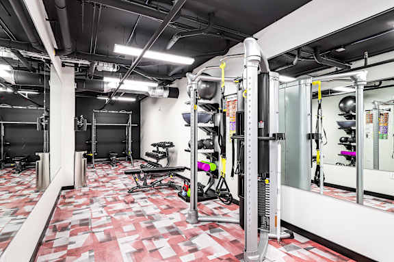 A gym with a red and white checkered floor.