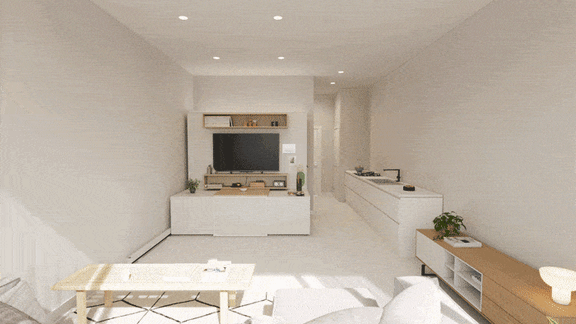 A living room with a television, a table, and a couch.