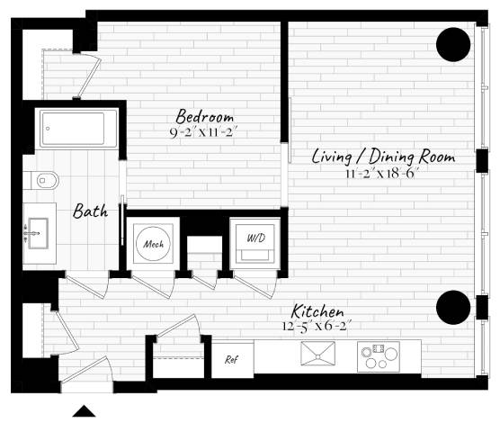 Floor Plan  A floor plan of a small apartment with a bedroom, living/dining room, kitchen, and bathroom.