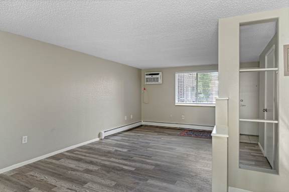 A room with a window and a door.
