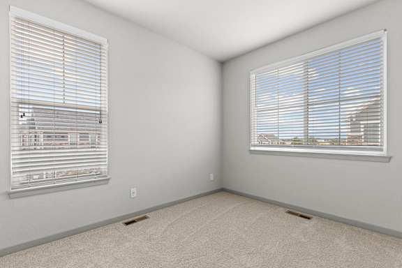 Comfortable Bedroom With Large Window at The Point at Biscay, Aurora, Colorado