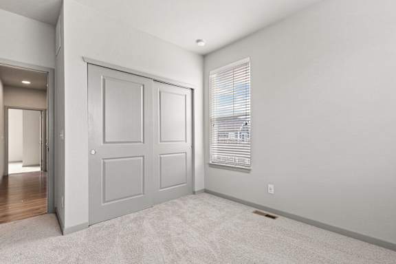Comfortable Bedroom With Accessible Closet at The Point at Biscay, Aurora, CO, Colorado