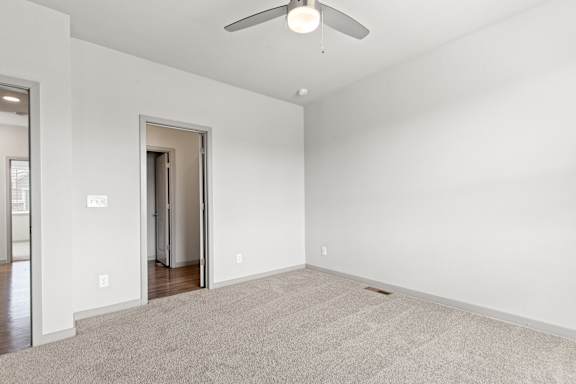 Bedroom with ceiling fan at The Point at Biscay, Aurora, Colorado
