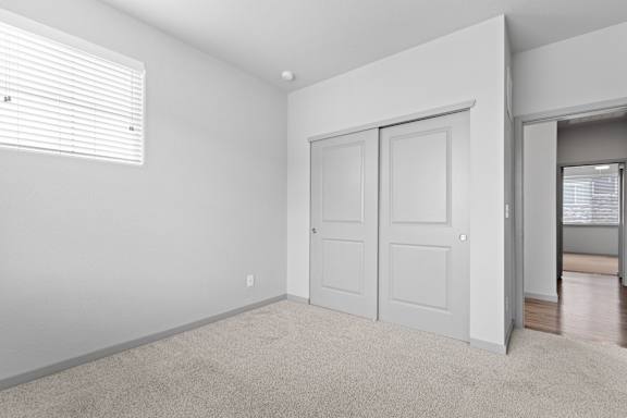 Bedroom With Expansive Windows at The Point at Biscay, Aurora