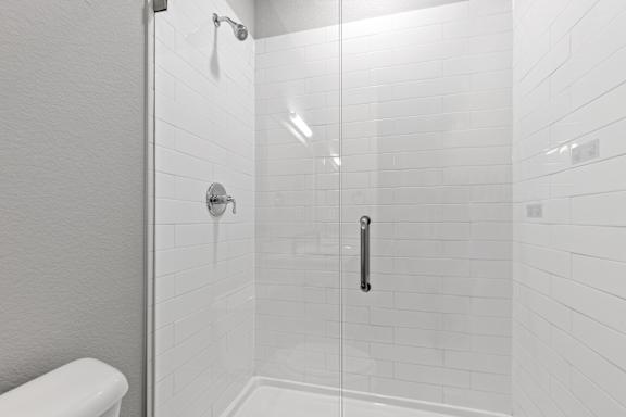 Bathroom with a shower and a sink at The Point at Biscay, Aurora, CO, Colorado