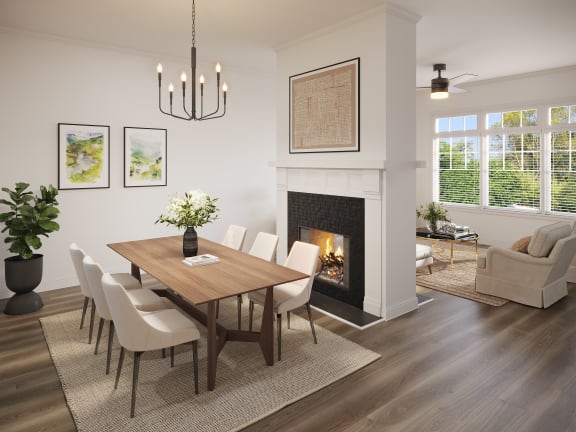 Dining room with fireplace and bay windows in living room