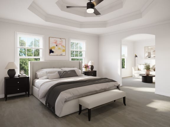 bedroom with white walls and a coffered ceiling and sunroom