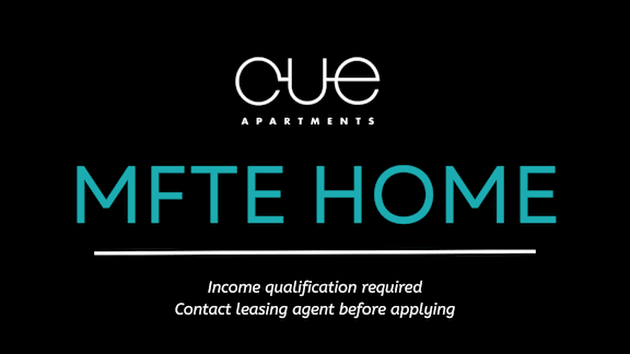 A black and white image of a sign for Cue Apartments with the words MFTE HOME on it.