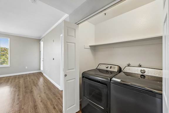 A laundry room with a washer and dryer.