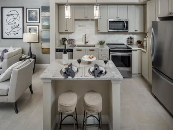 A modern kitchen with a dining table and chairs.