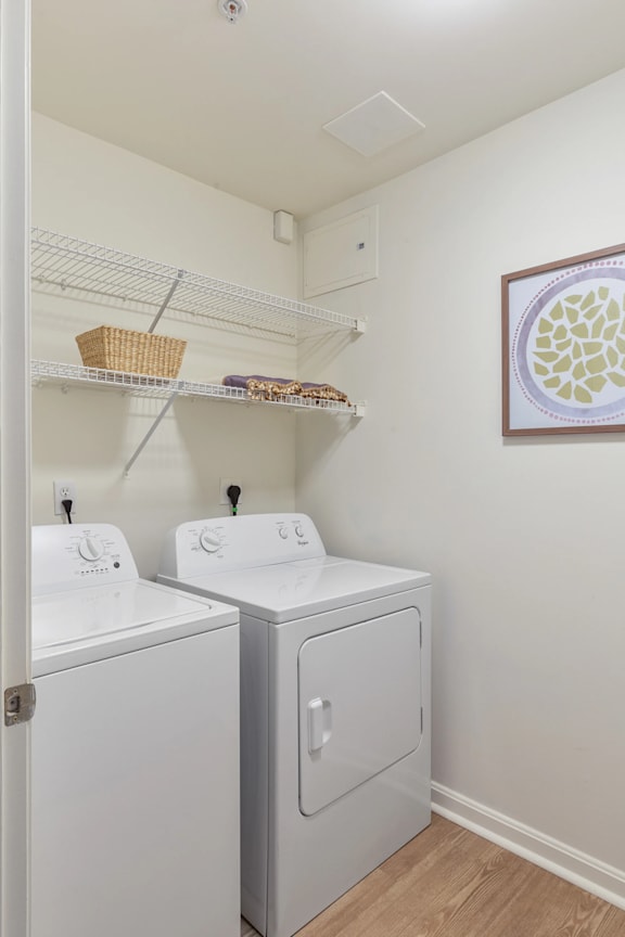 A small laundry room with a washer and dryer.