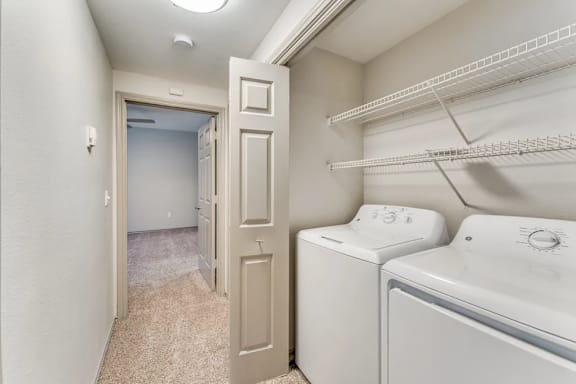 A laundry room with a washer and dryer.