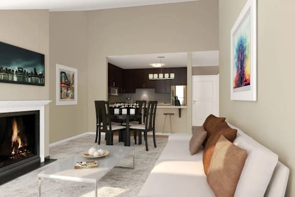 A modern living room with a fireplace and a dining table set up.