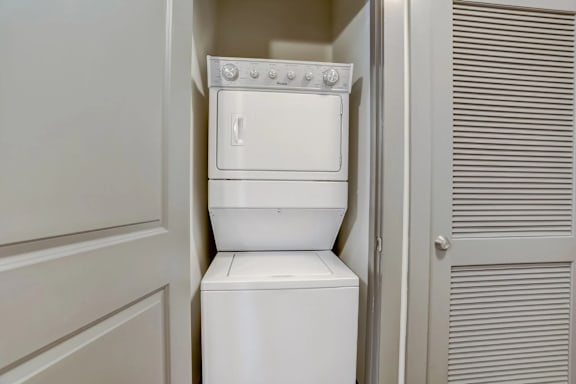 A white dishwasher is installed in a kitchen.