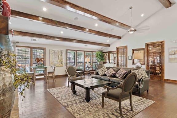A living room with a large sofa and a coffee table.
