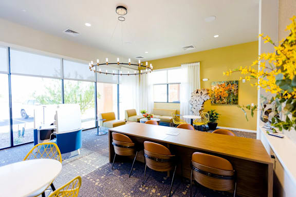 A conference room with a long table and chairs.