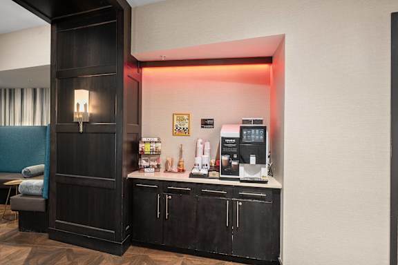 A room with a black cabinet and a red light.