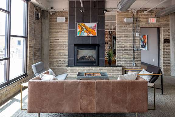 a living room with a couch and a fireplace