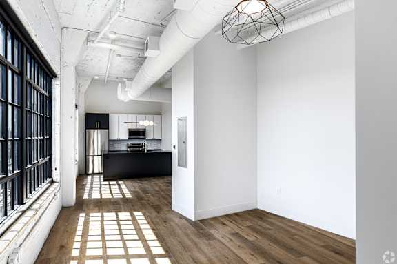 A room with a white ceiling and a black and white checkered floor.